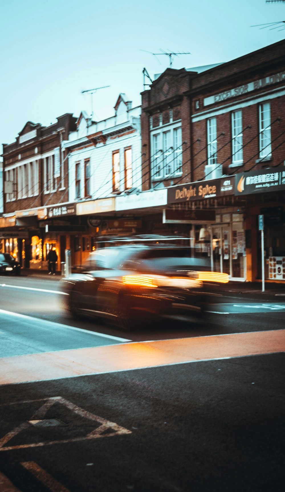 cars on road near buildings during daytime