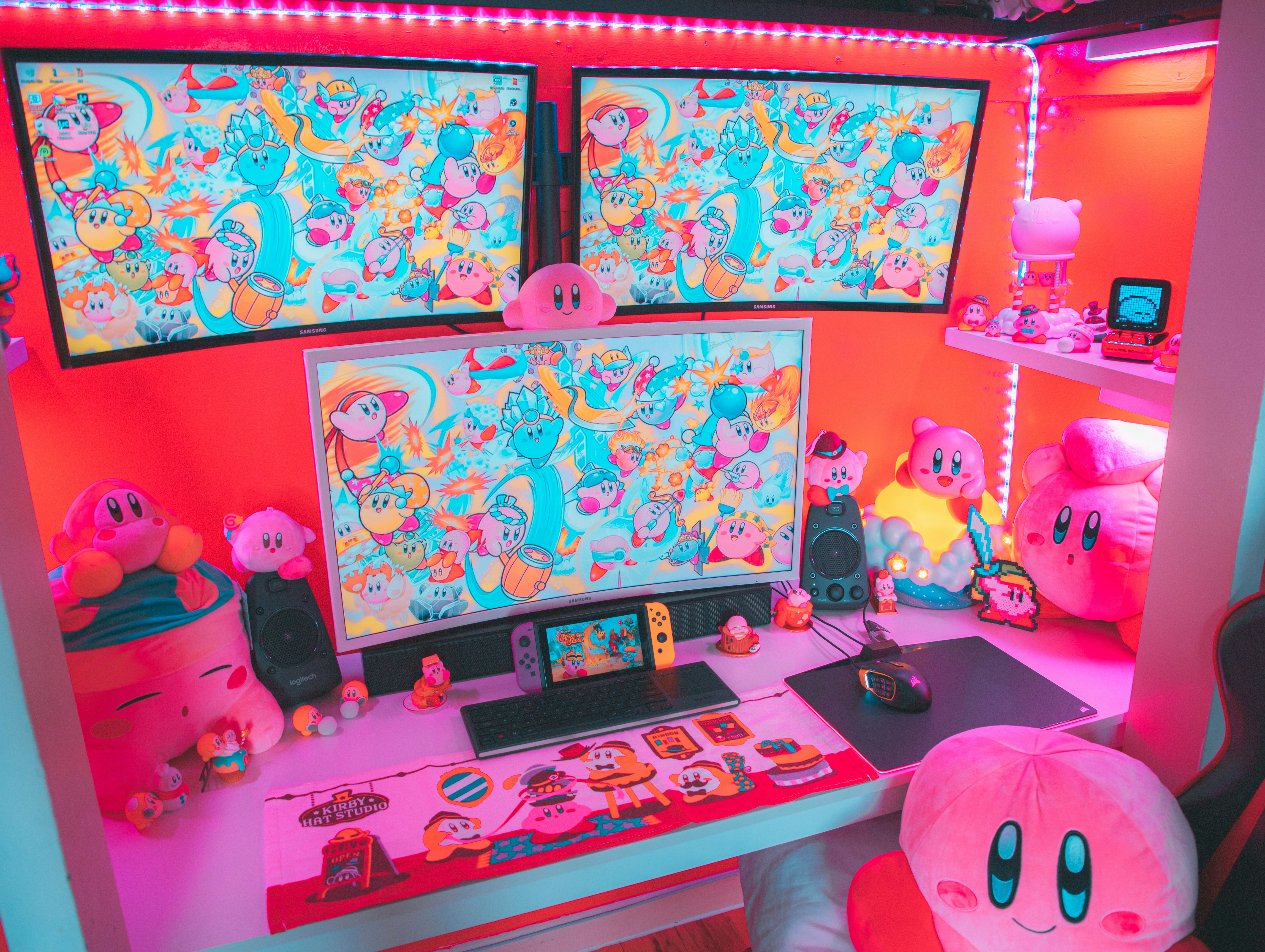 black laptop computer on pink bed