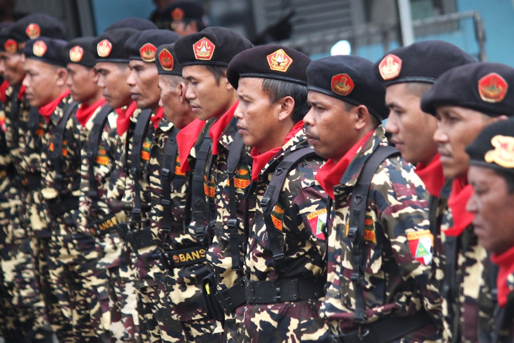 men in blue and black camouflage uniform