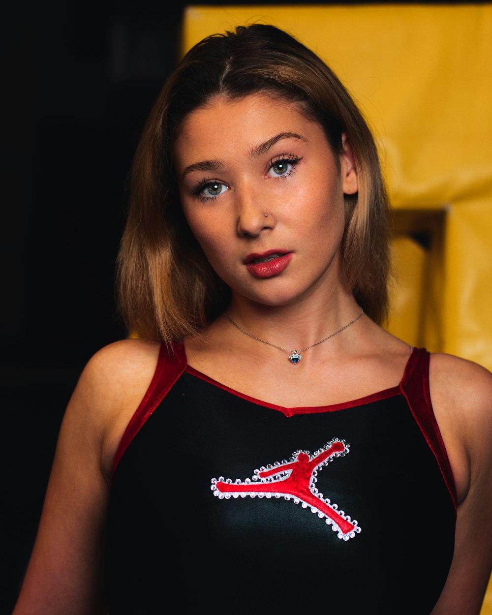 woman in black and red tank top