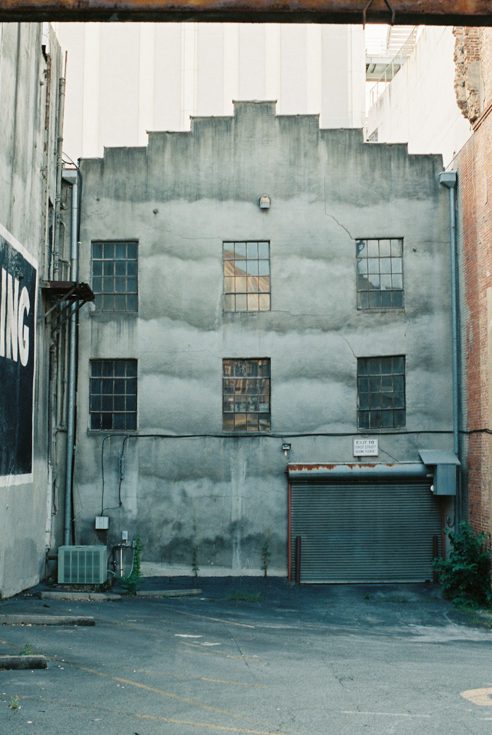 gray concrete building with brown wooden window