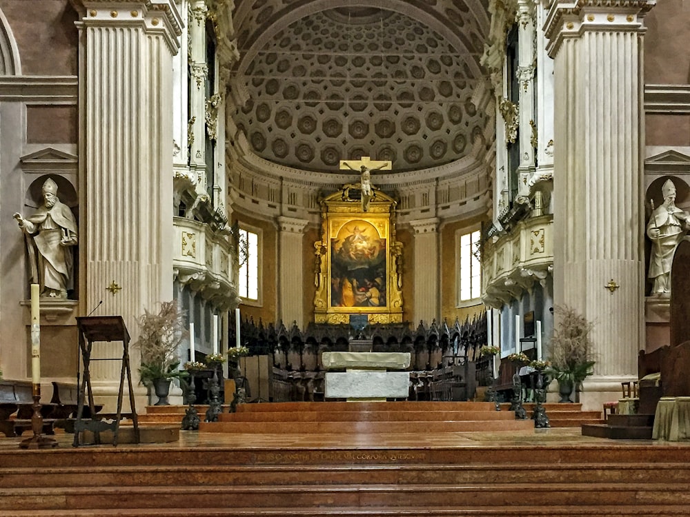 brown wooden bench inside cathedral