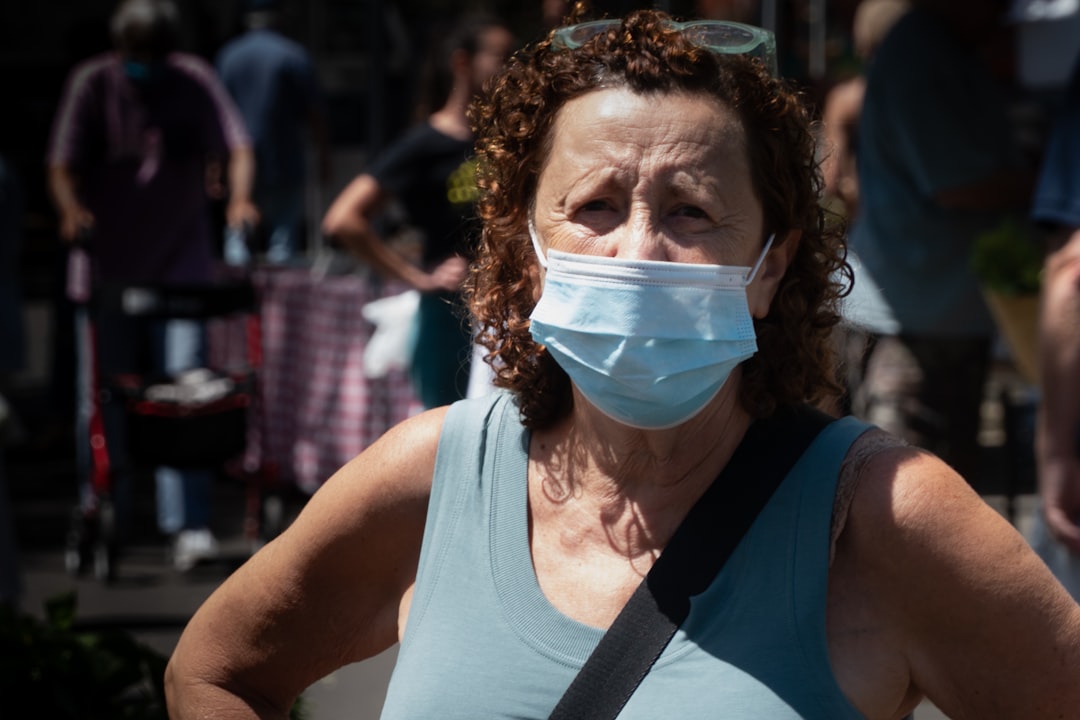 woman in white tank top with white face mask
