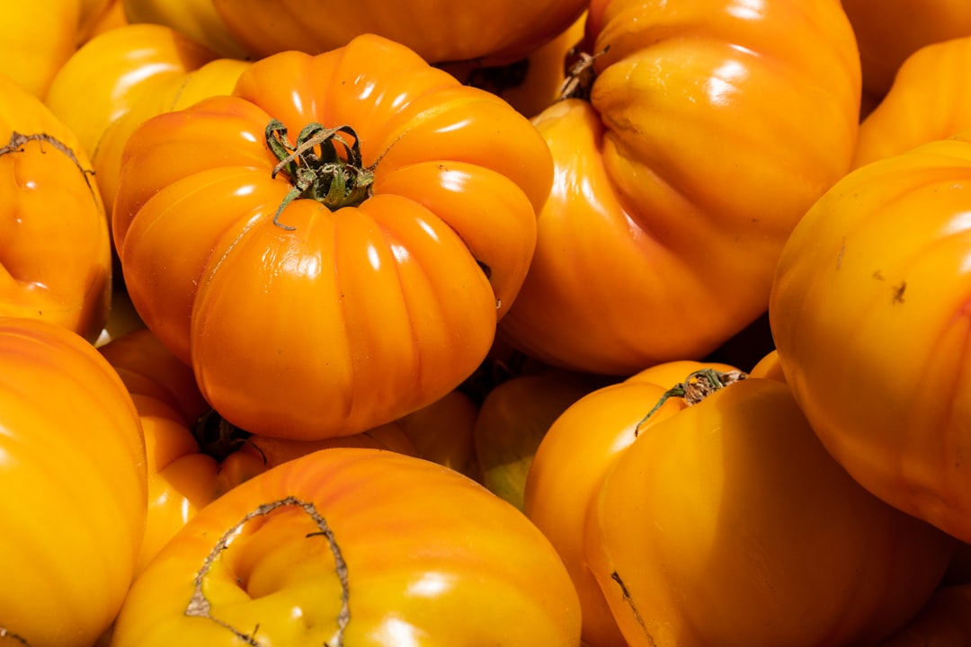 orange pumpkins on brown wooden table