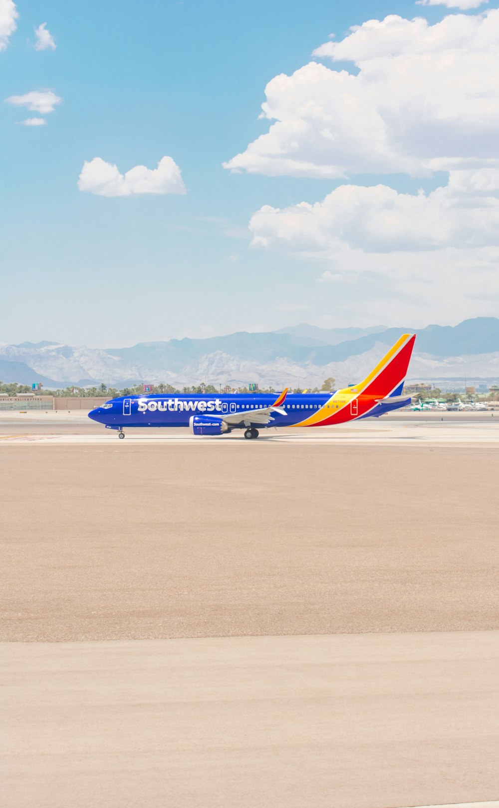 a southwest airlines plane on the runway at an airport