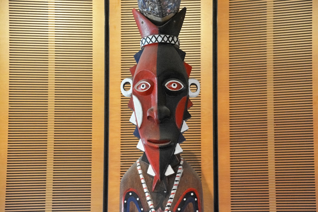 red and black wooden mask