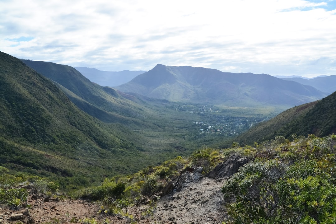 green mountains under white clouds during daytime