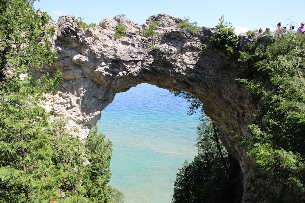 gray rock formation near body of water during daytime