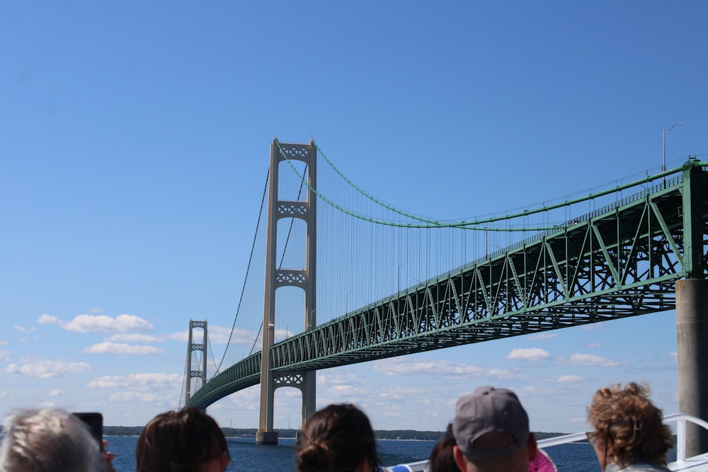 people on bridge during daytime