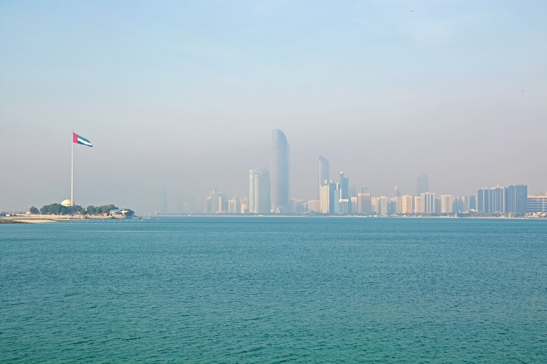 city skyline across body of water during daytime