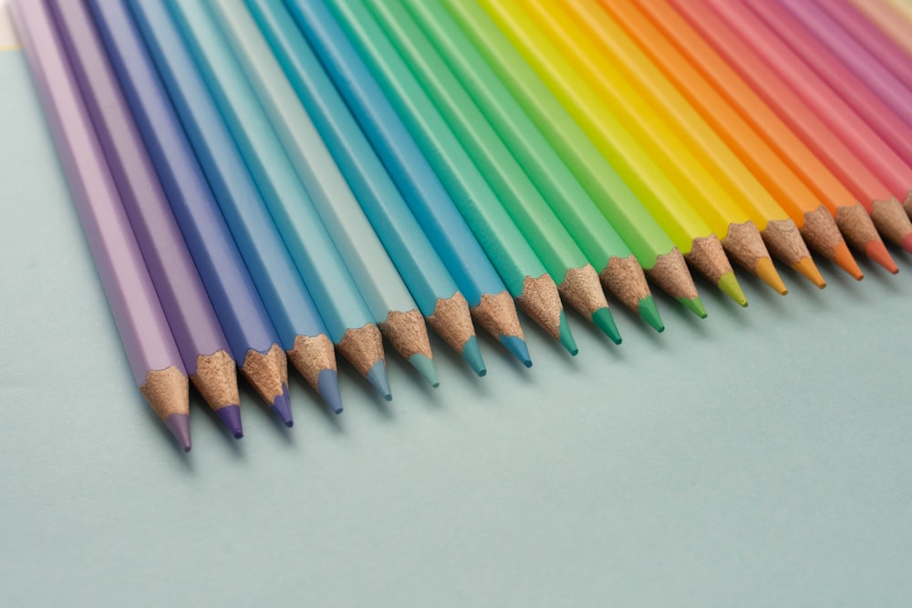 multi color coloring pencils on white table