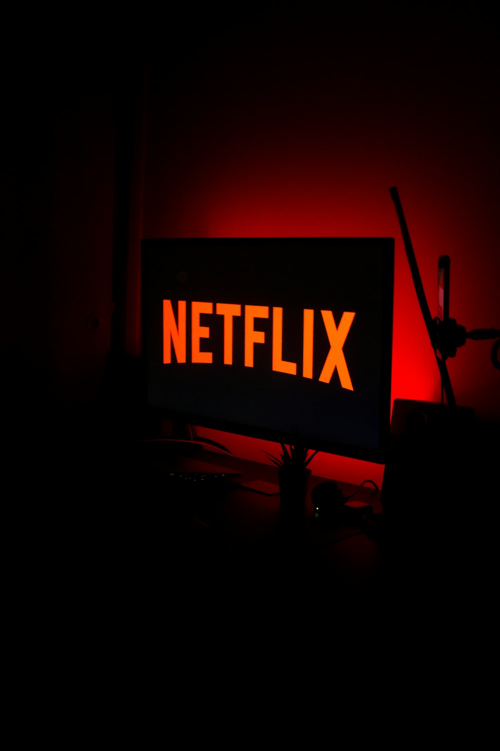 a red netflix sign sitting on top of a desk