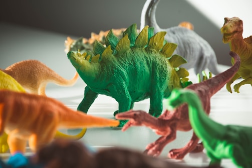 green and orange dragon plastic toy