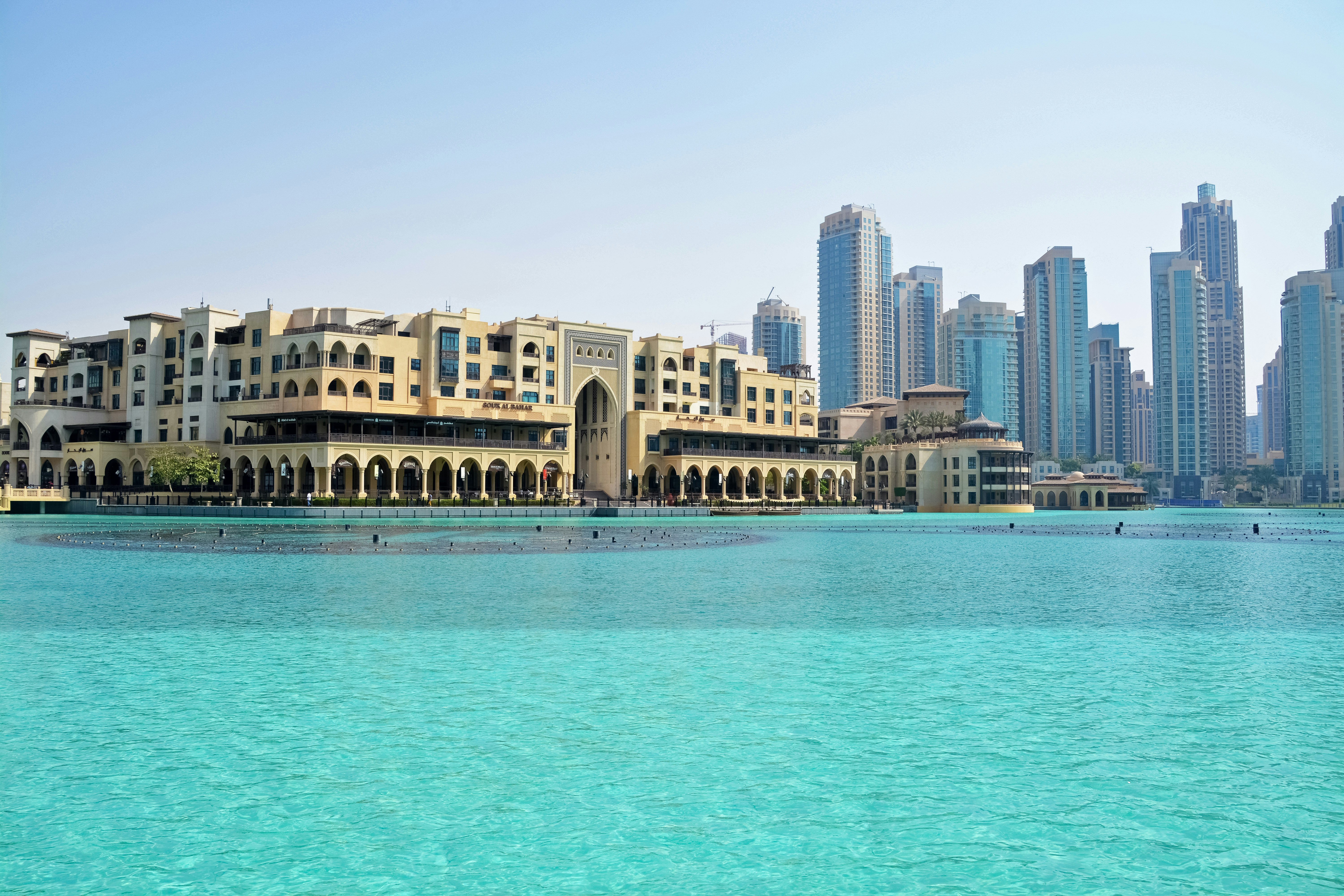 body of water near high rise buildings during daytime