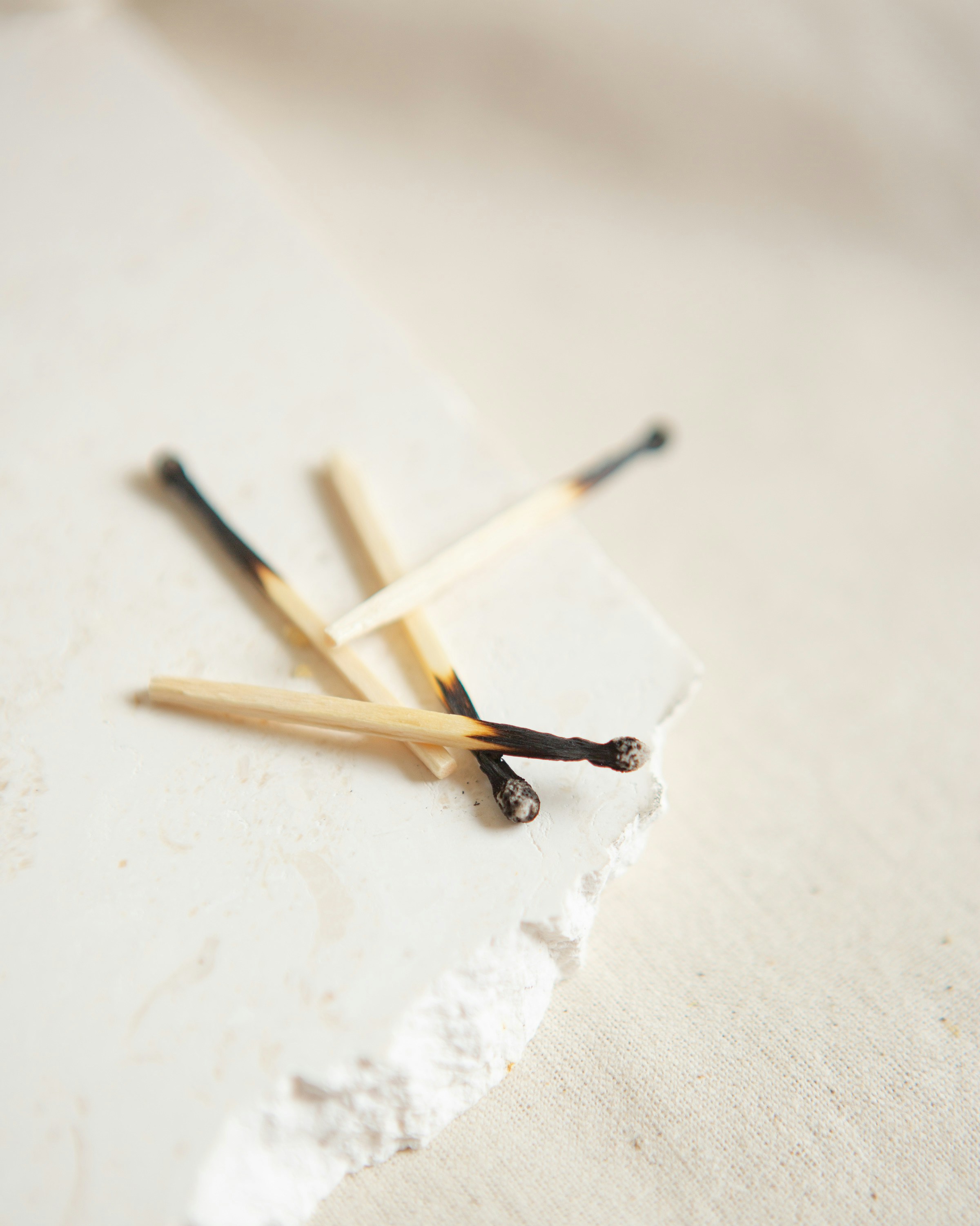 brown and white wooden sticks on white surface
