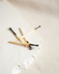 brown and white wooden sticks on white surface