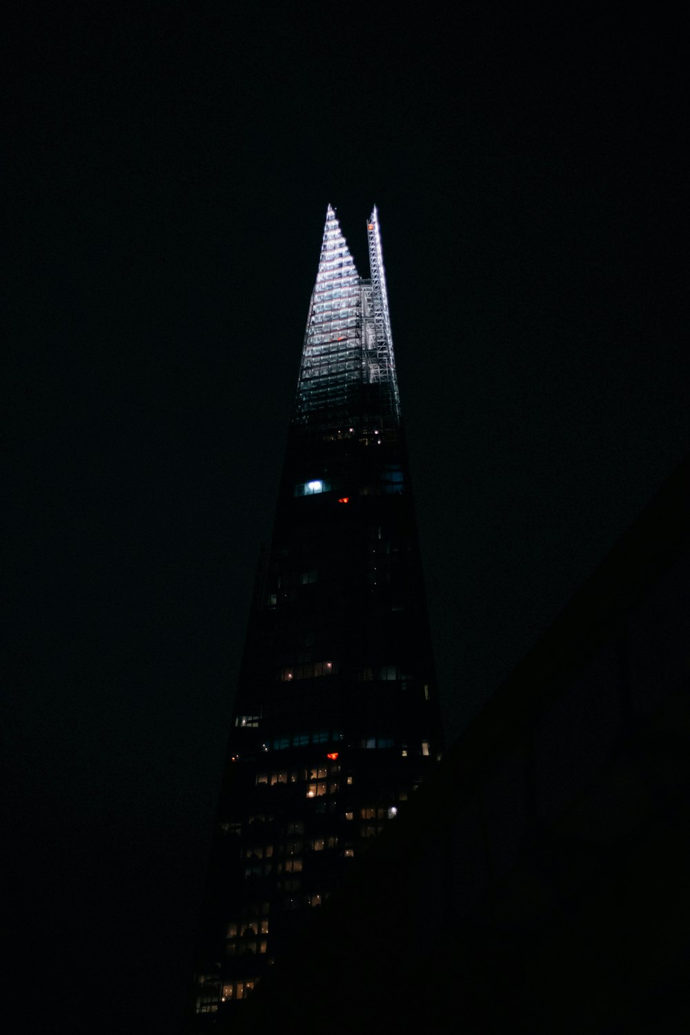 black and white high rise building during night time