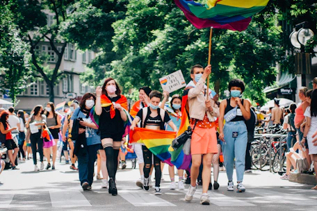 A group of diverse people walking peacefully through Paris streets during the march.