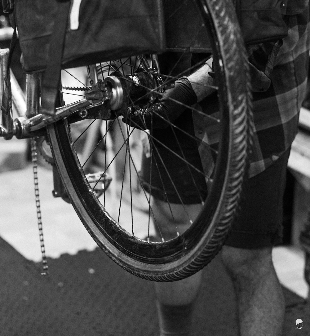 grayscale photo of bicycle wheel