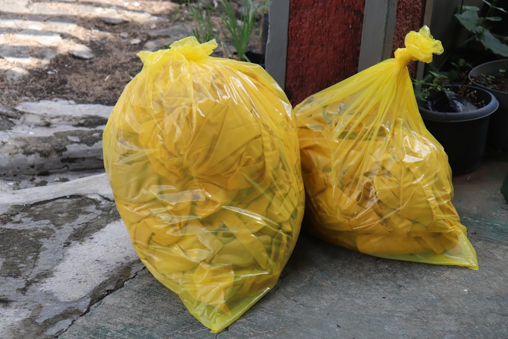 yellow plastic bag on gray concrete floor