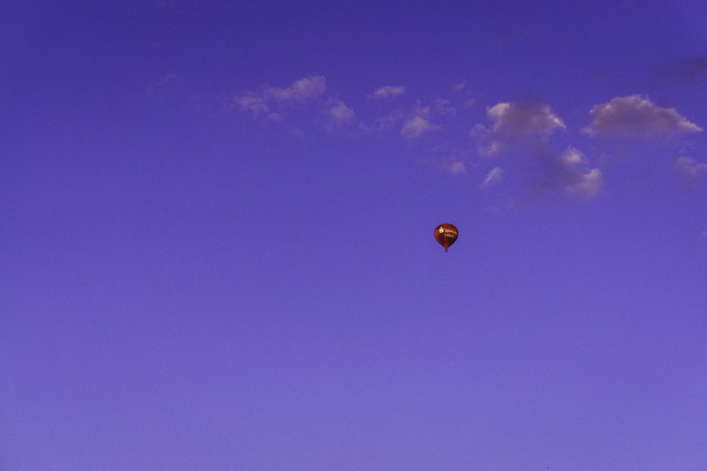 red hot air balloon in the sky