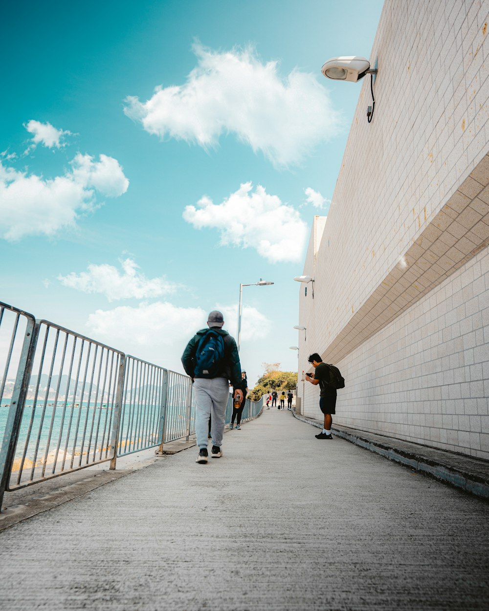 people walking on sidewalk during daytime