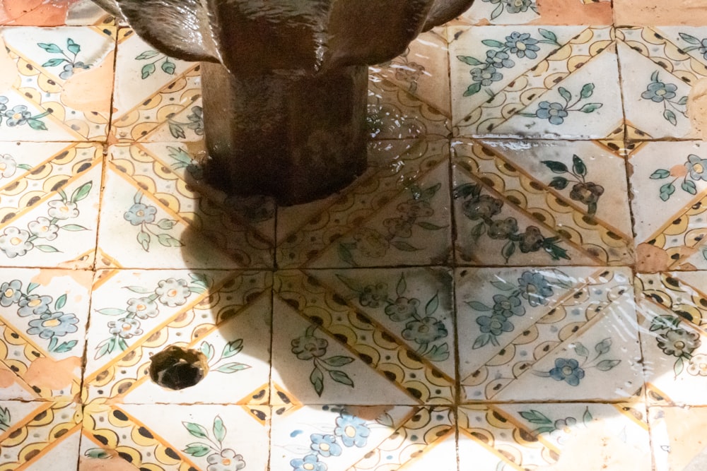 brown and white floral floor tiles