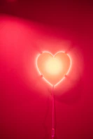 A soft pink heart chakra glowing gently with tender, loving light.