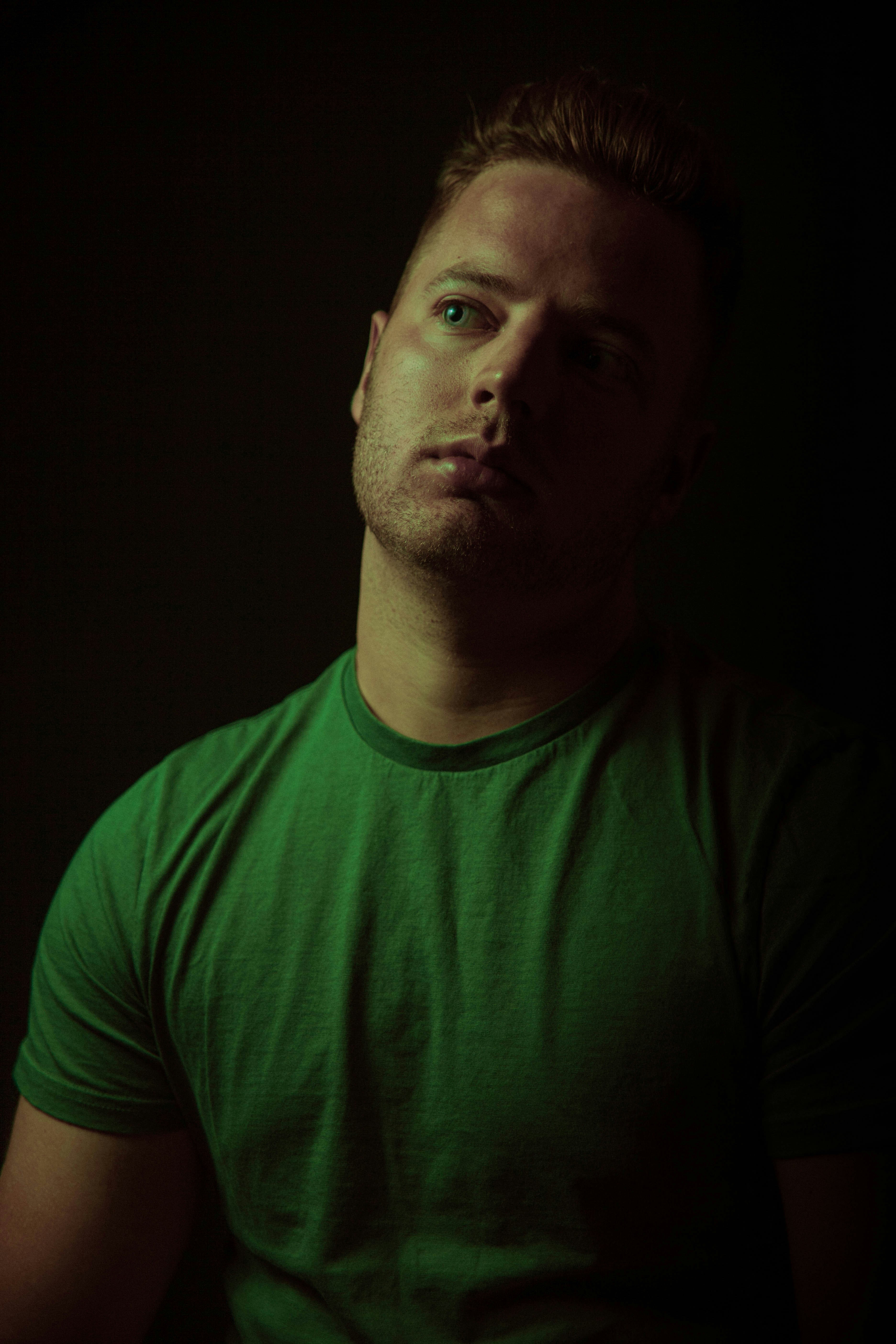 man in green crew neck shirt