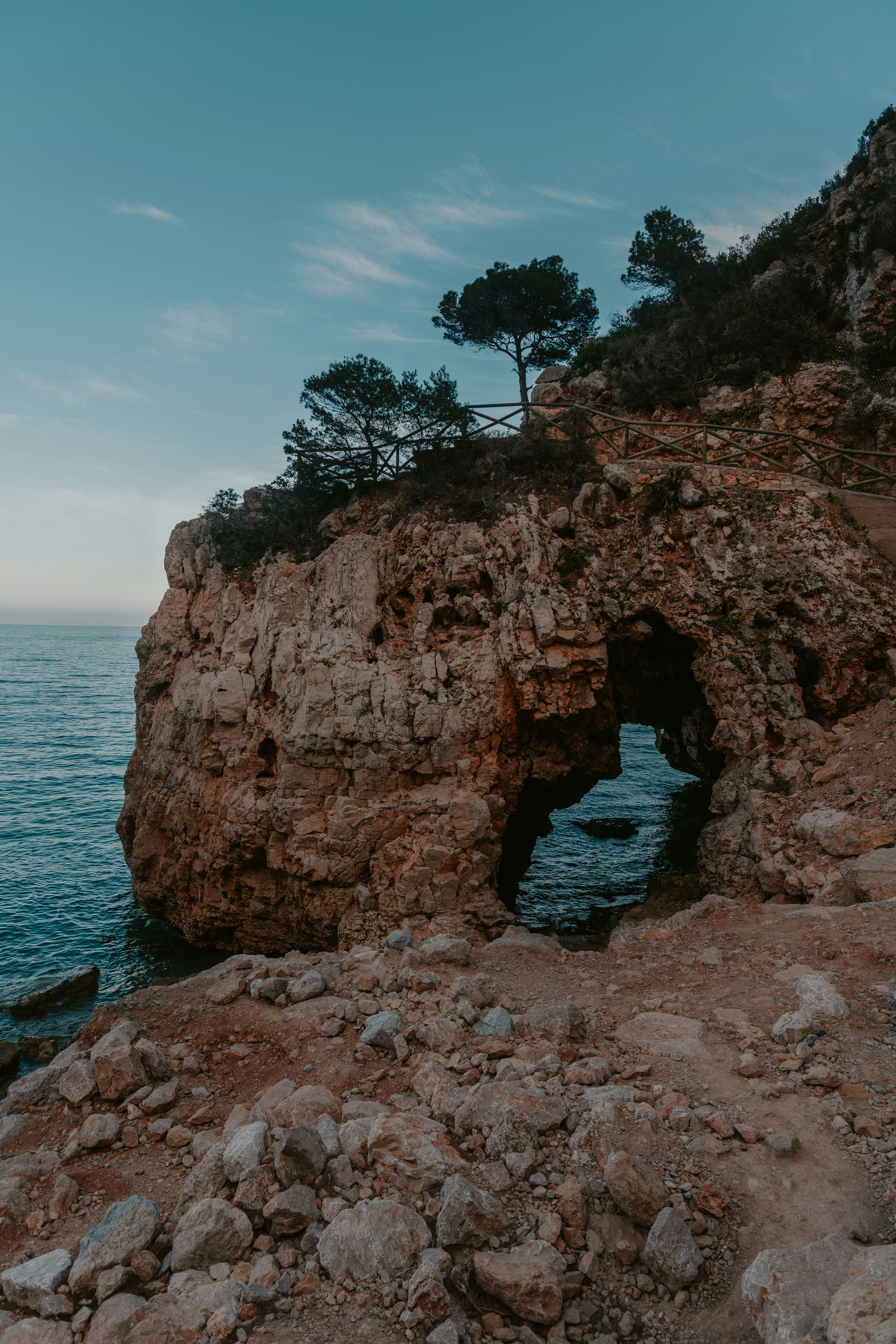 brown rock formation on sea during daytime