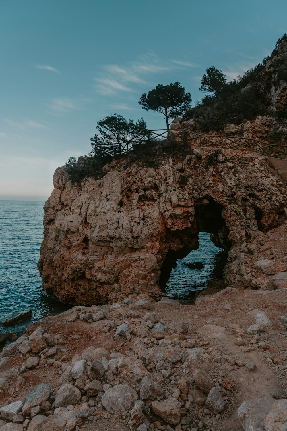 brown rock formation on sea during daytime