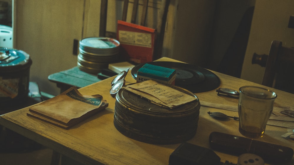 black round container on brown wooden table