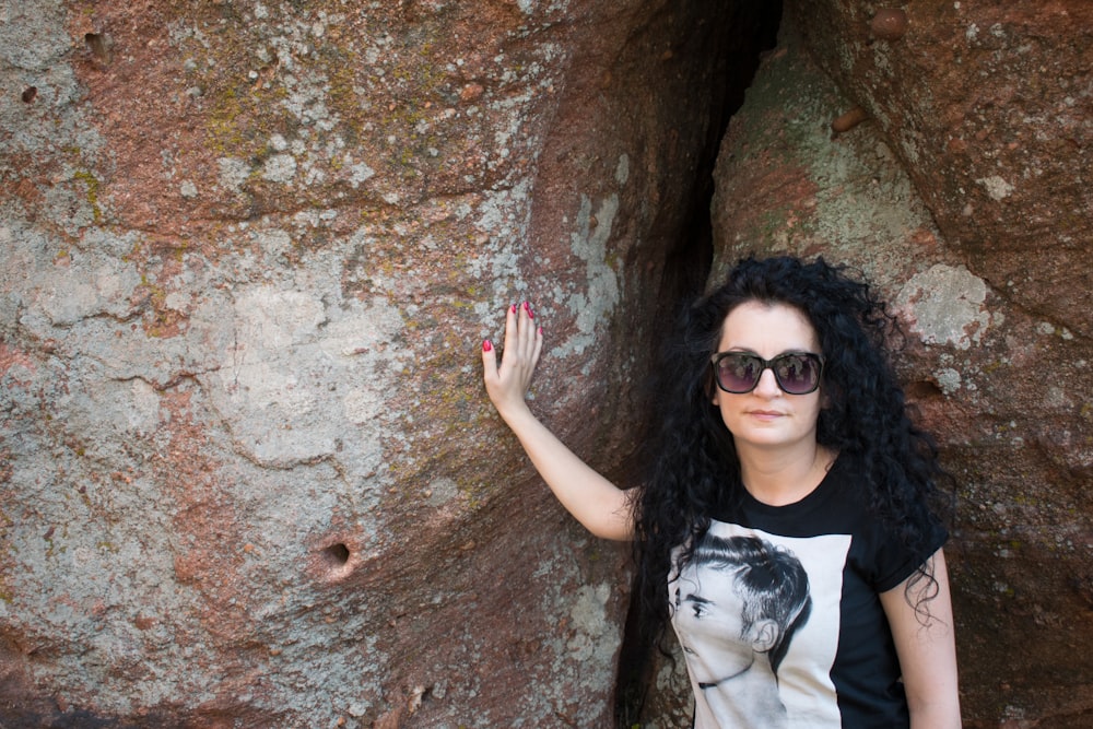 woman in black and white crew neck shirt wearing black sunglasses