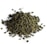 A pile of tightly rolled tea leaves with a textured and irregular surface, predominantly green in color, scattered over a white background.