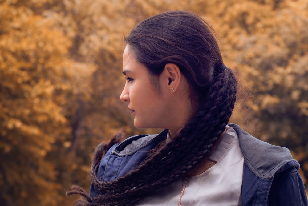 woman in white shirt and black leather jacket