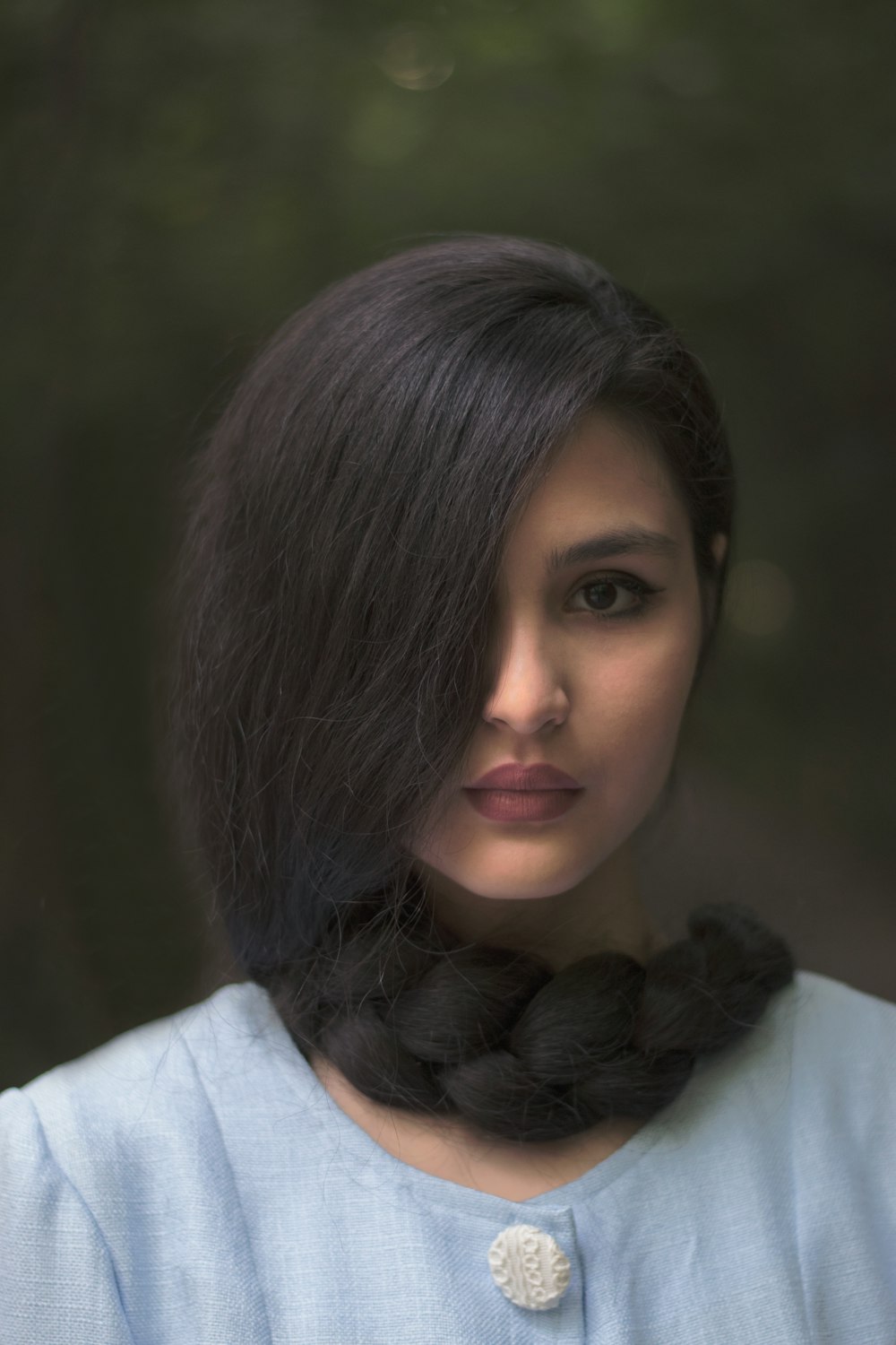 woman in white shirt with black hair