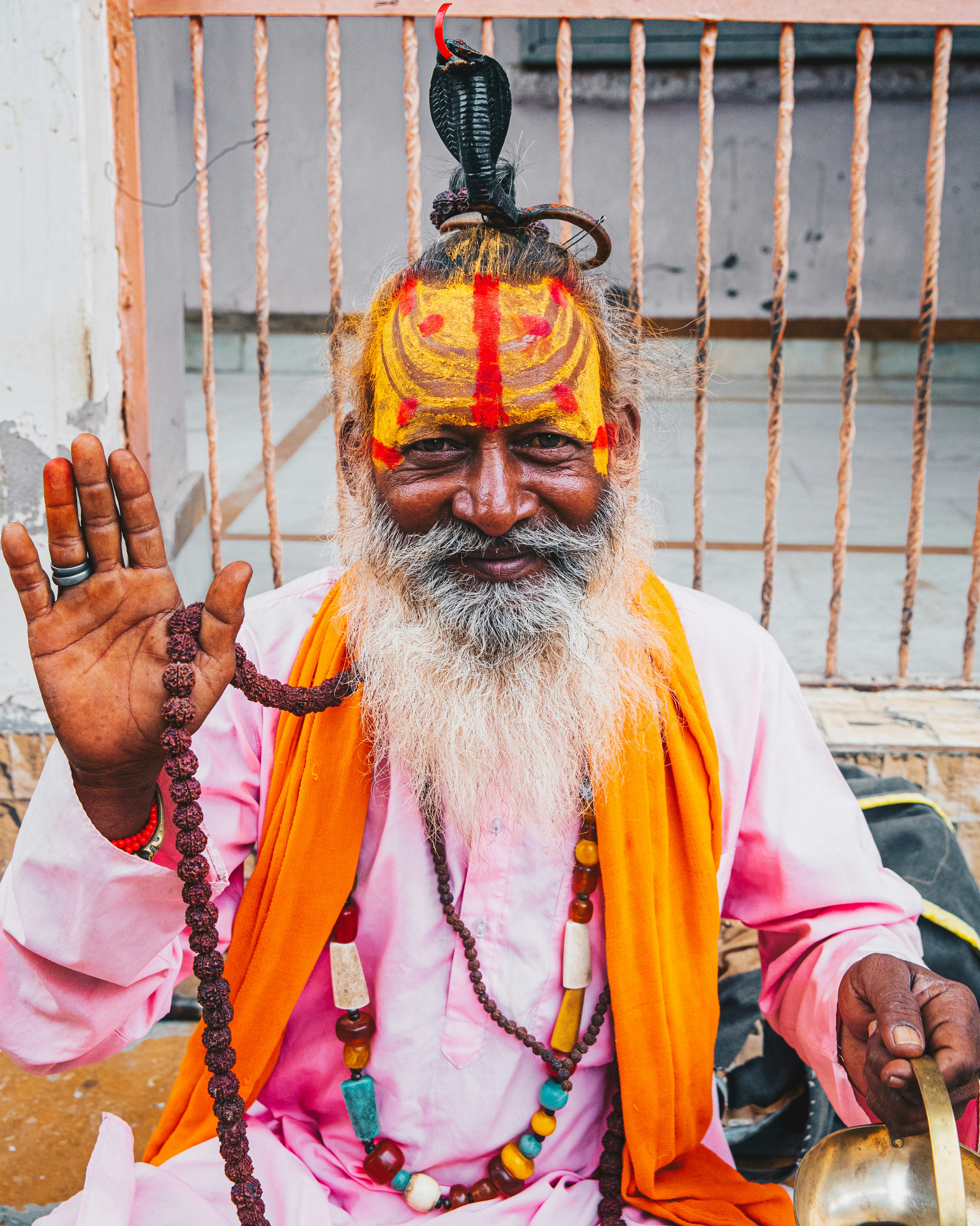 man in white long sleeve shirt with yellow and red face paint