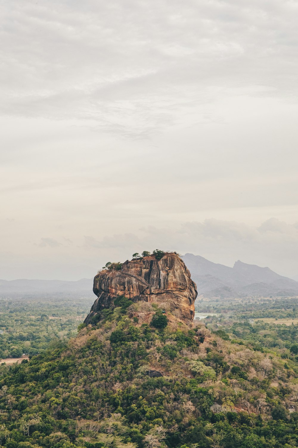 brown rock formation under white sky during daytime