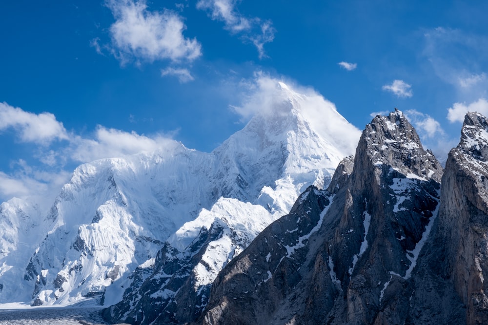 snow covered mountain under blue sky during daytime