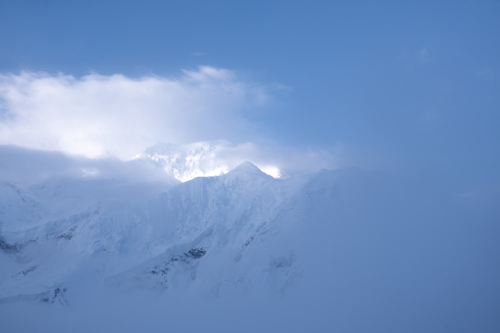 snow covered mountain under blue sky during daytime