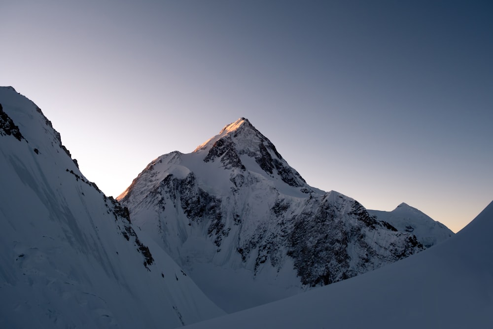 snow covered mountain under blue sky during daytime