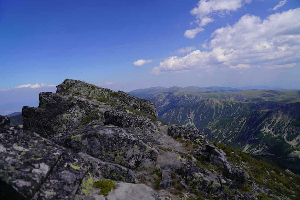 green and gray mountain under blue sky during daytime