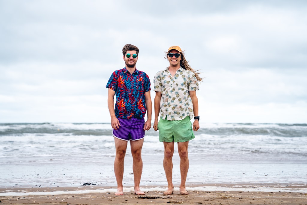 Couple enjoying a beach photoshoot together during golden hour