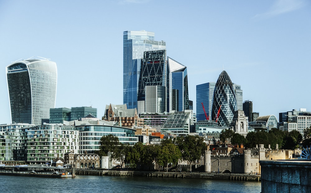 city buildings near body of water during daytime