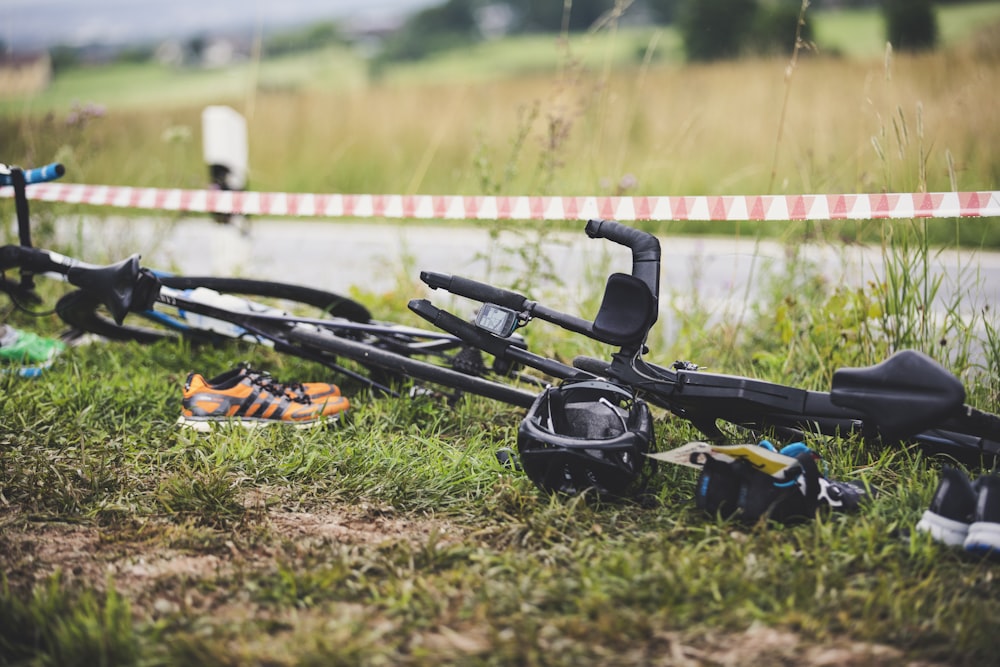 black bicycle on green grass field during daytime