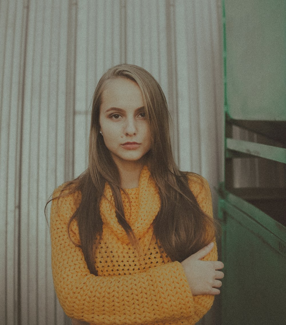 woman in orange knit sweater