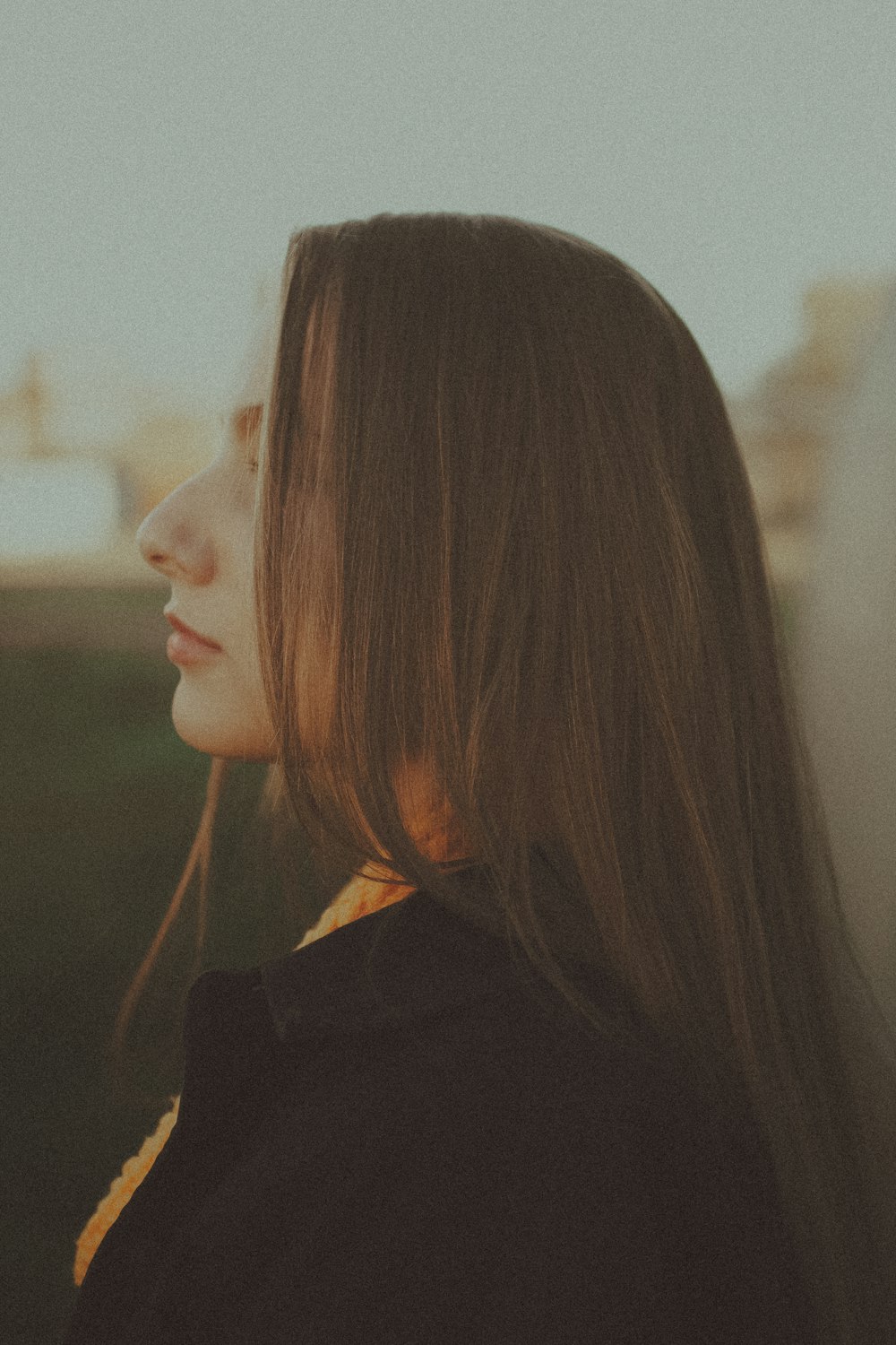 woman in black shirt with brown hair