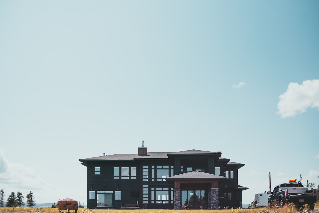 black and white concrete building under blue sky during daytime