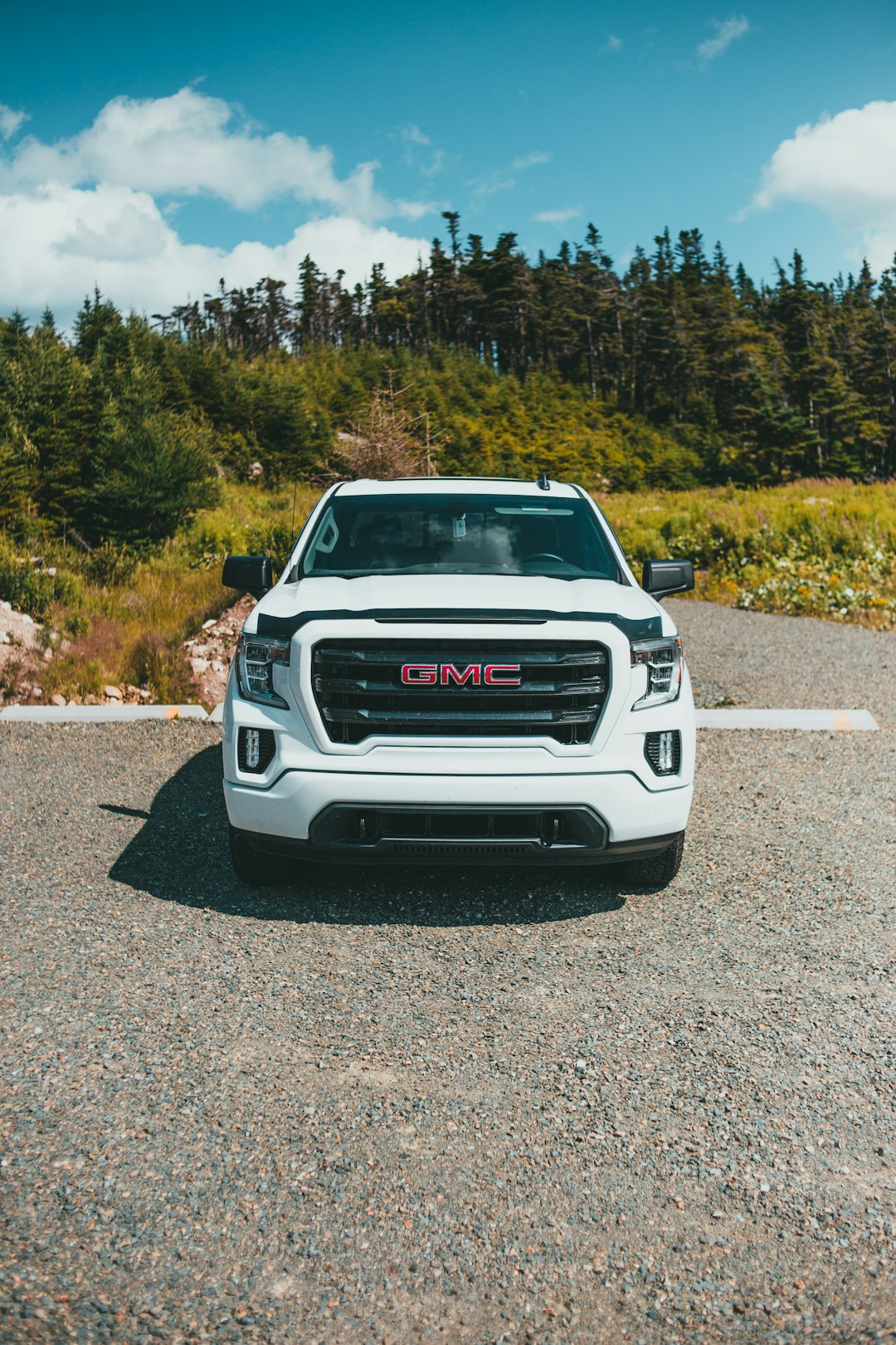 white chevrolet car on road during daytime