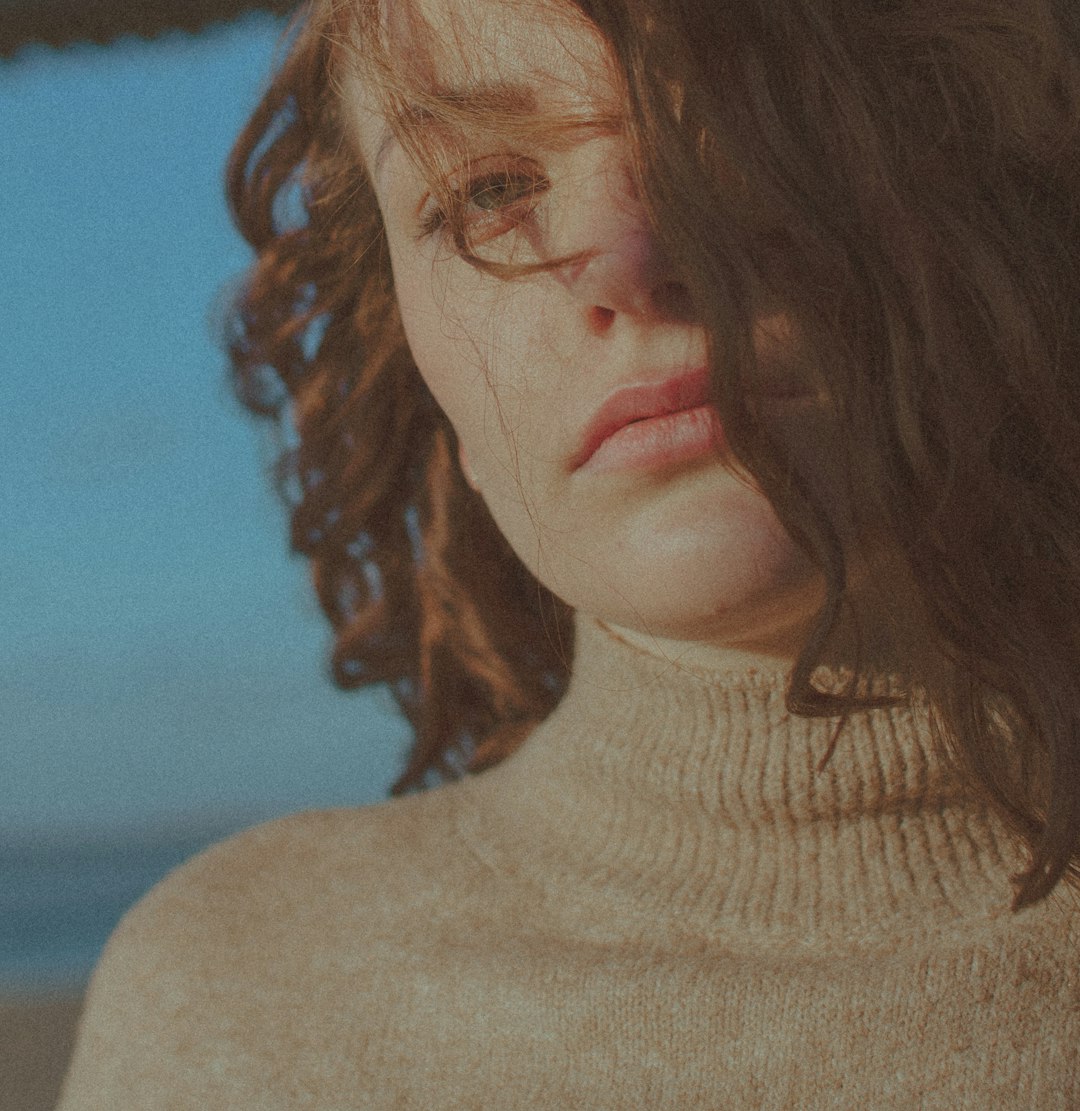 woman in beige turtleneck sweater